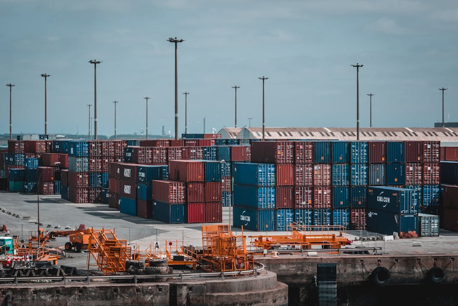 Colorful cargo containers stacked at a busy industrial port, showcasing global trade.